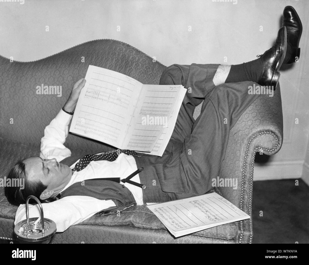 WALT DISNEY candid during recording of music for FANTASIA 1940 orchestra conducted by Leopold STOKOWSKI Animated Feature Film Walt Disney Productions / RKO Radio Pictures Stock Photo