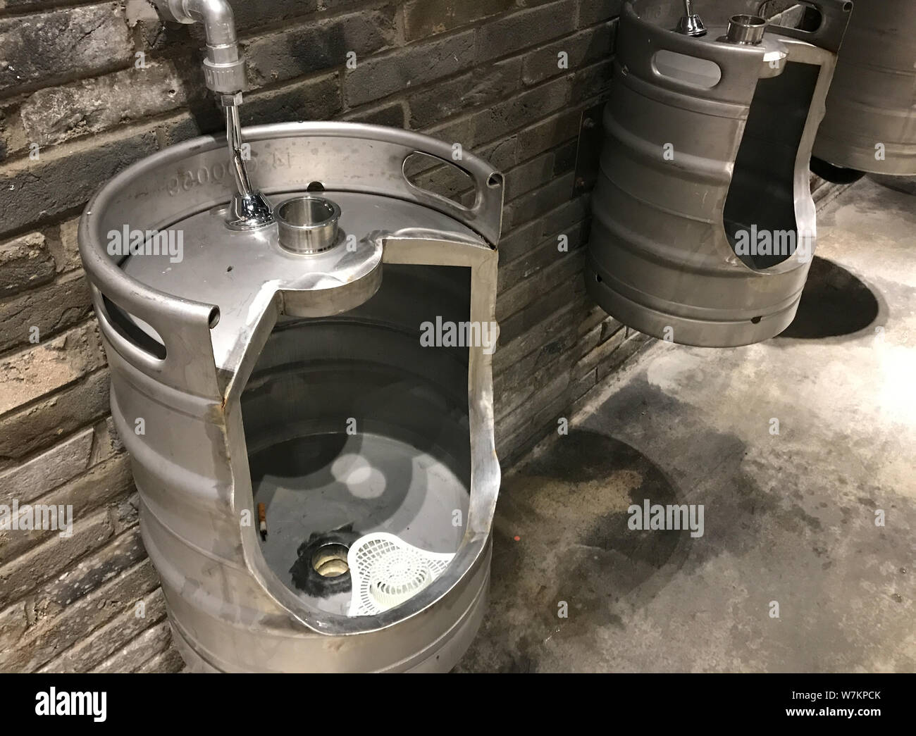 A beer barrel transformed into an urinal is seen at a shopping mall in