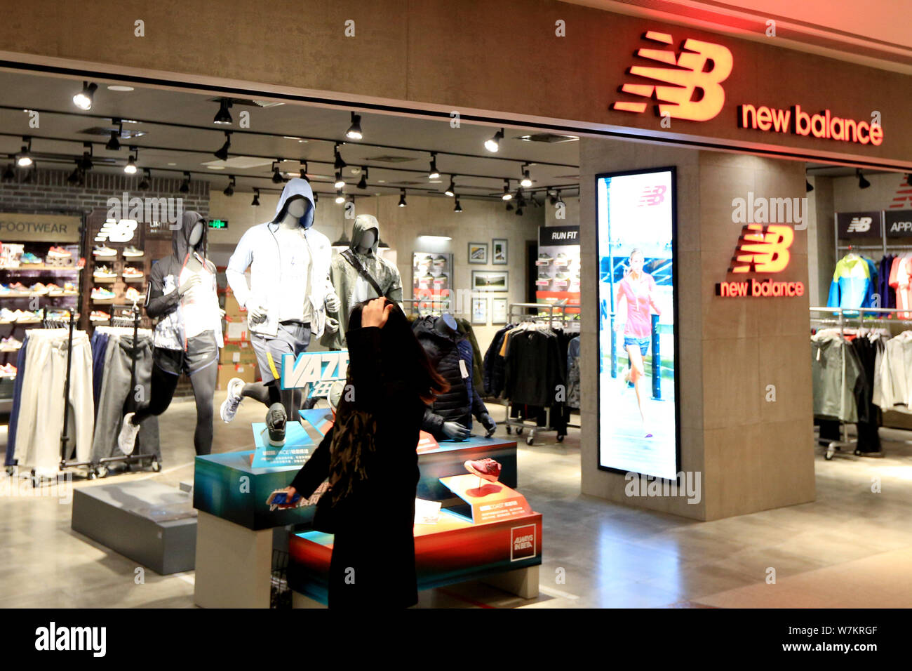 FILE--View of a sportswear store of New Balance in Shanghai, China, 13  January 2016. New Balance has successfully sued three local shoemakers who  Stock Photo - Alamy