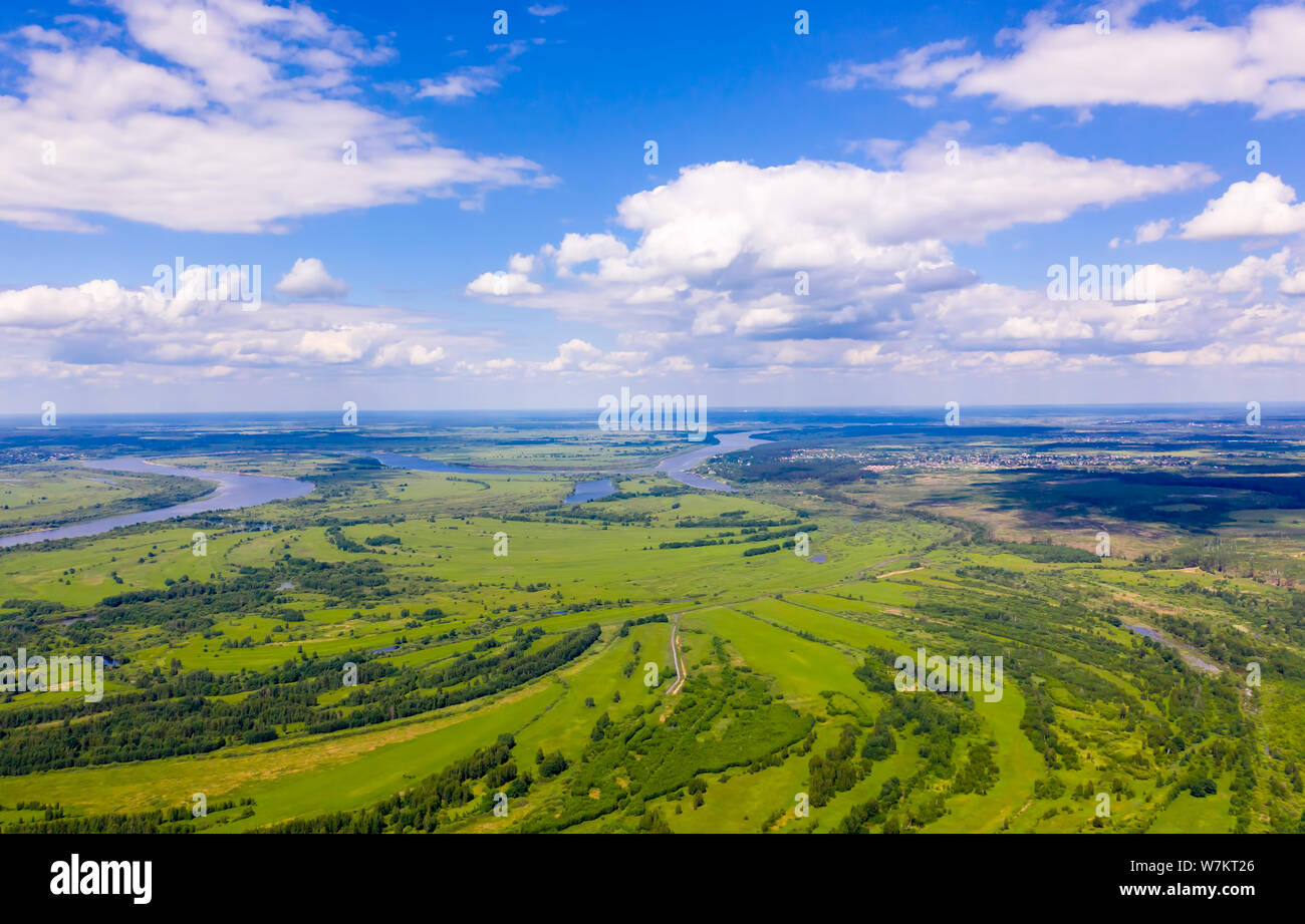 Aerial fly over green meadows hi-res stock photography and images - Alamy