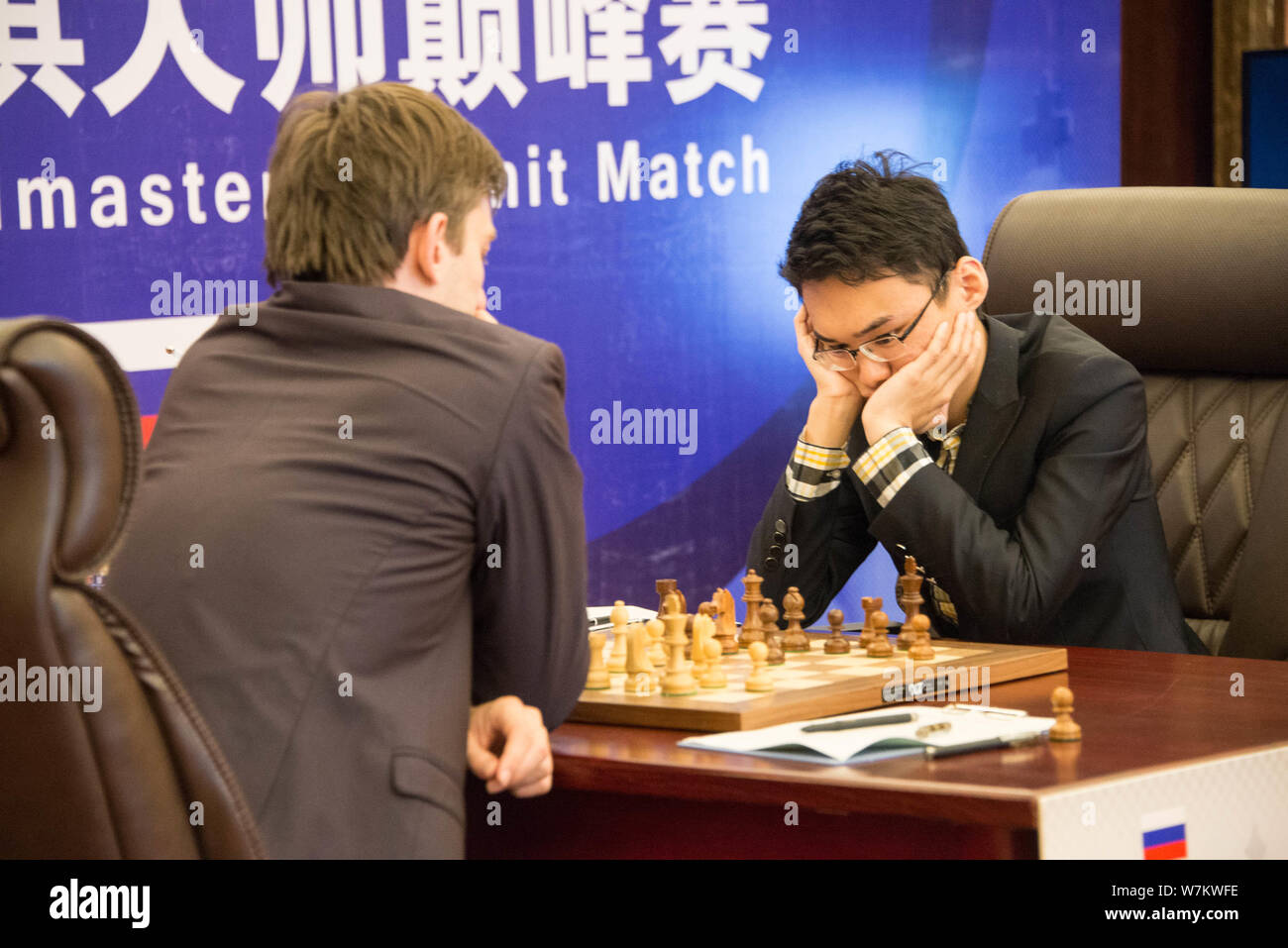 Chinese chess grandmaster Yu Yangyi, right, competes against Russian chess grandmaster Alexander Igorevich Grischuk during the 2017 China-Russian Ches Stock Photo