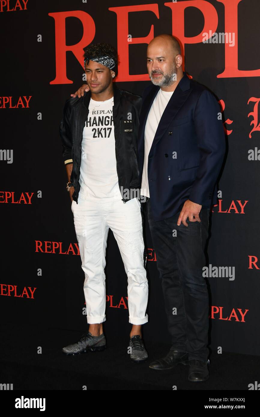 Brazilian football star Neymar, left, or Neymar Jr., poses as he arrives at  the fashion show of the Replay Fall/Winter 2017/18 collection with a label  Stock Photo - Alamy