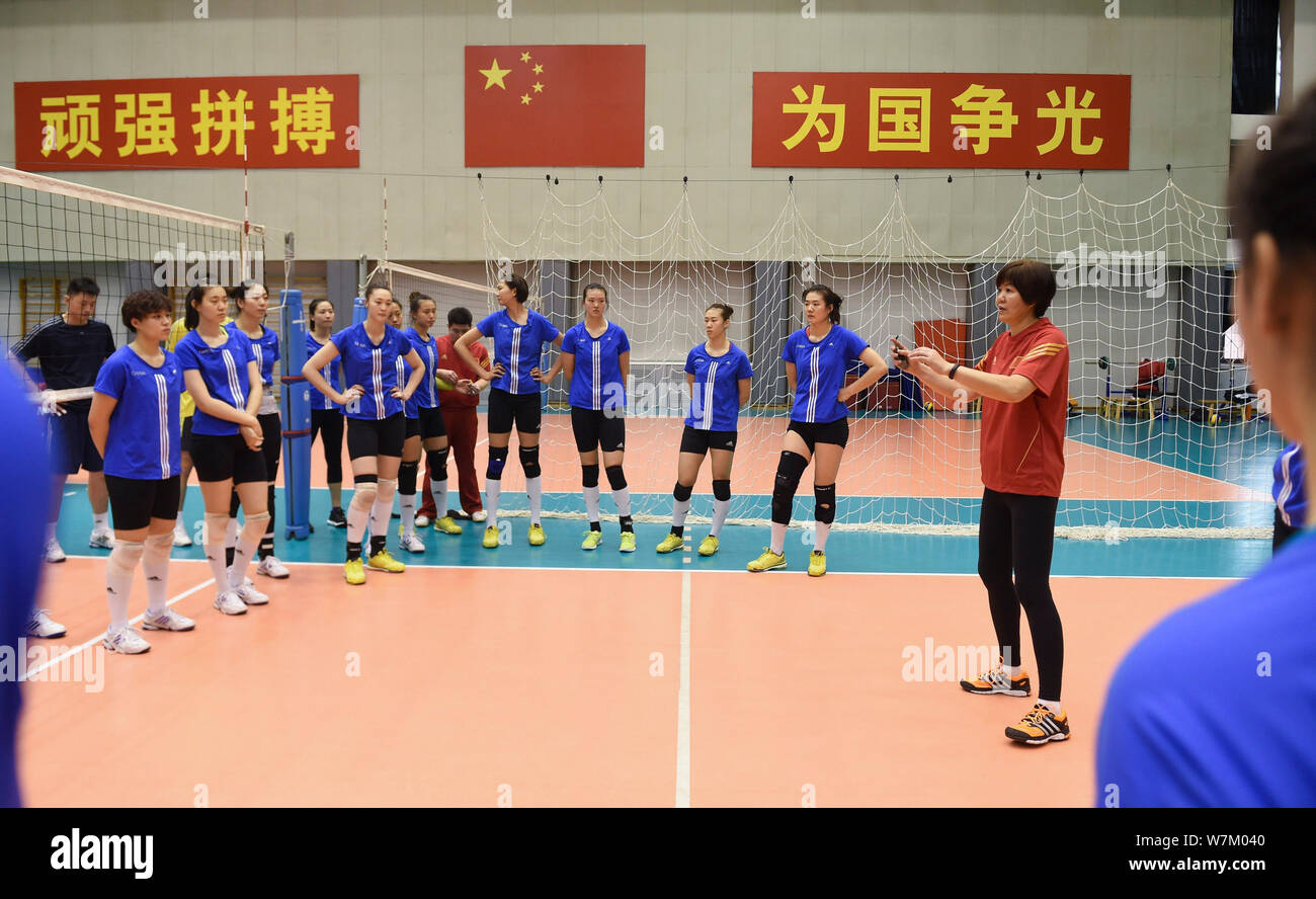 Beijing, China. 6th Aug, 2019. Lang Ping, head coach of China womens volleyball team, gives instructions to players in Beijing, capital of China, on March