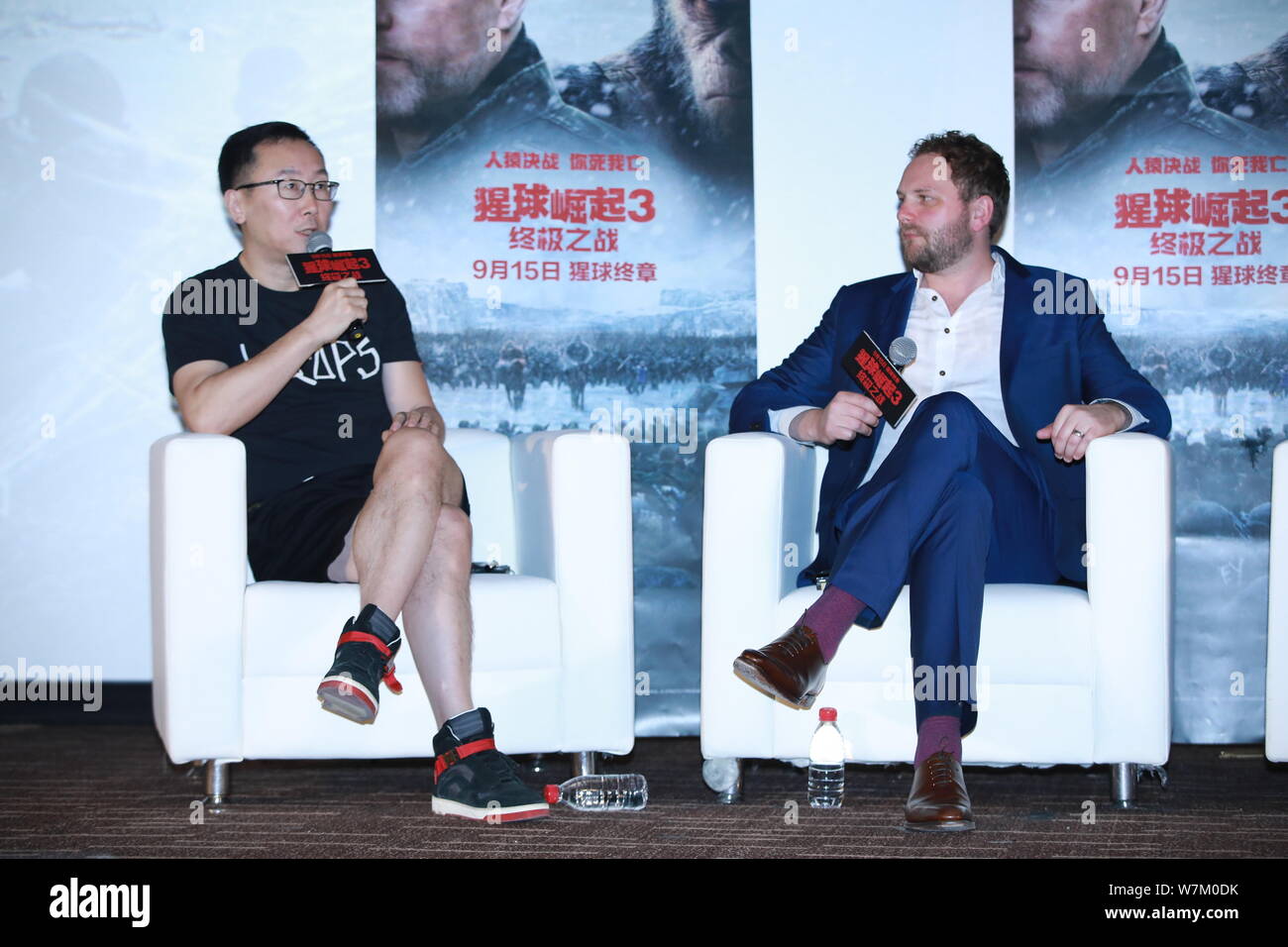 Chinese director Lu Chuan, left, and visual effects supervisor Ander Langlands attend a promotional event for the movie "War for the Planet of the Ape Stock Photo
