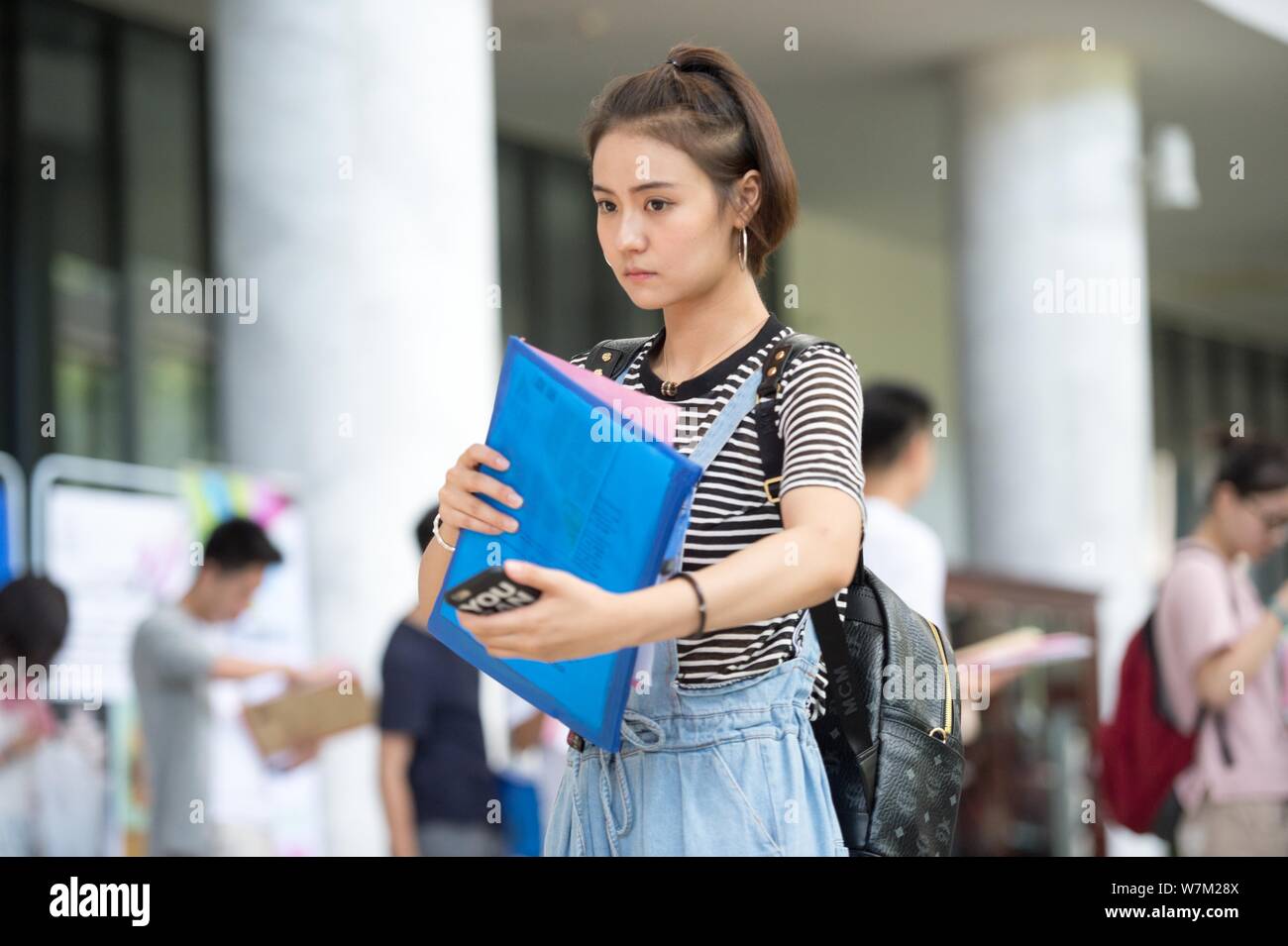 A uighur freshman student of Central Academy of Drama registers on the first day of school in Beijing, China, 24 August 2017.   Chinese freshmen stude Stock Photo