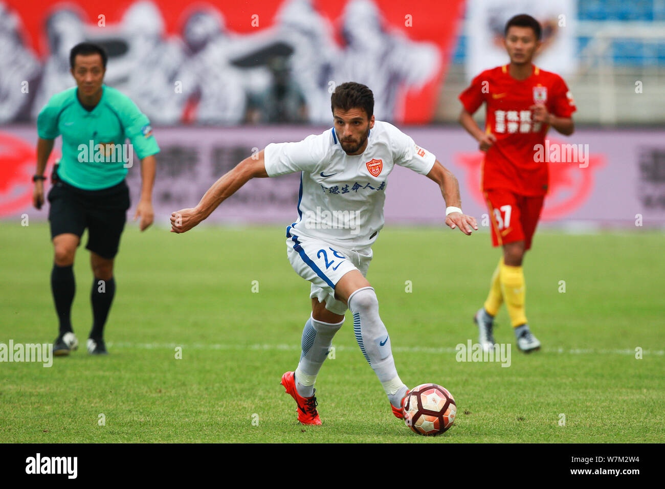 Albanian football player Valdet Rama of Yanbian Funde kicks the ball to ...