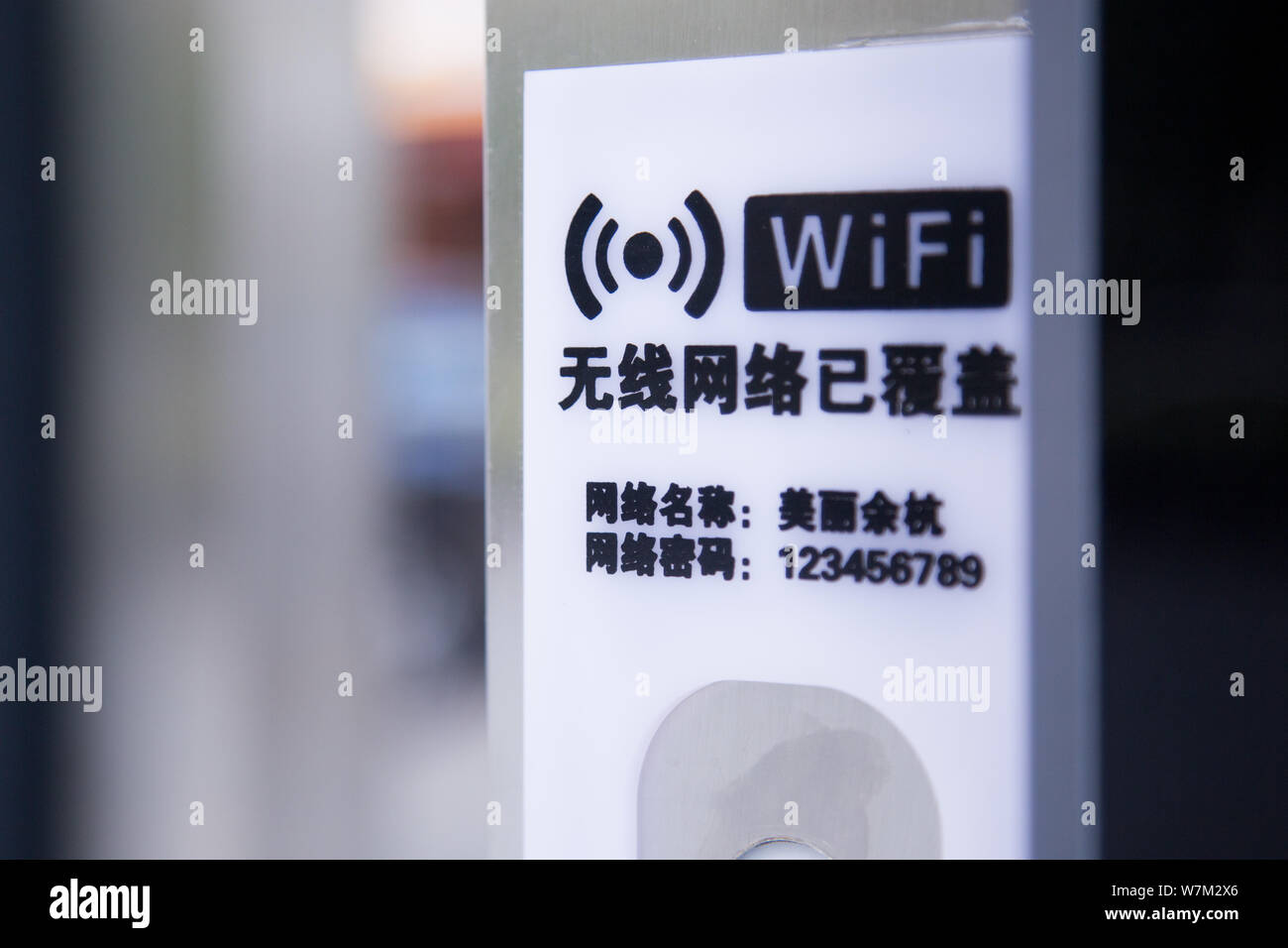 View of a signboard showing the WiFi network name and password at