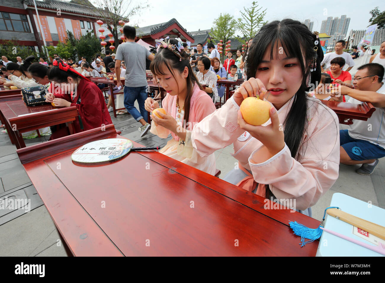Chinese women dressed in traditional costumes take part in a cultural