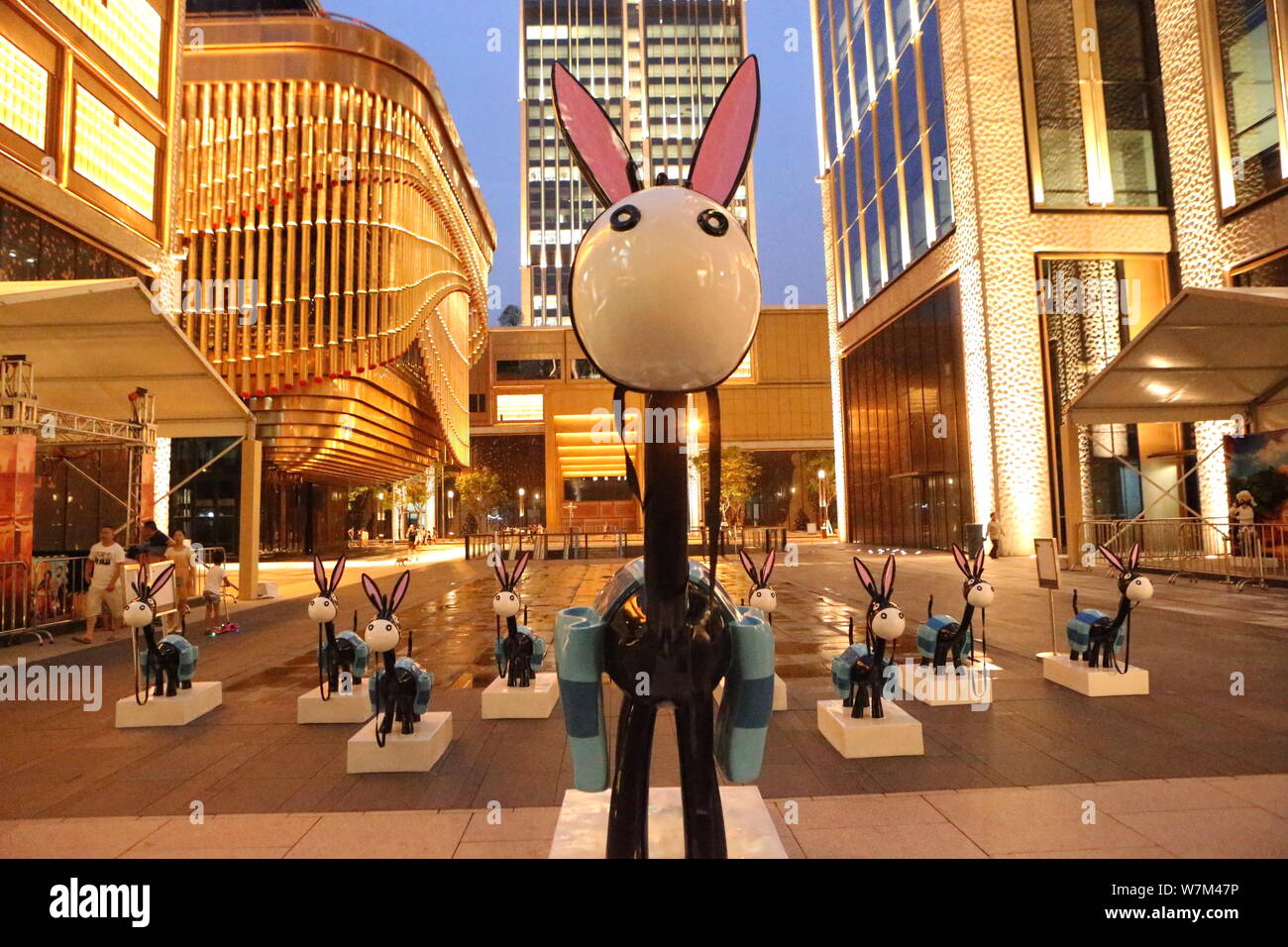 A 3.5-meter high giant donkey and small donkeys are on display during the largest Avanti-themed exhibition at the Bund Finance Centre (BFC) in Shangha Stock Photo