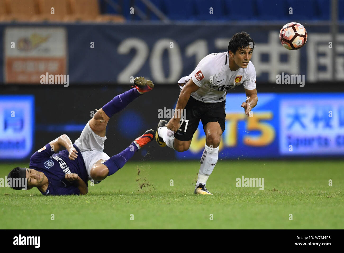 Heibi Rohrturen Brazilian football player Aloisio, right, of Hebei China Fortune kicks ...