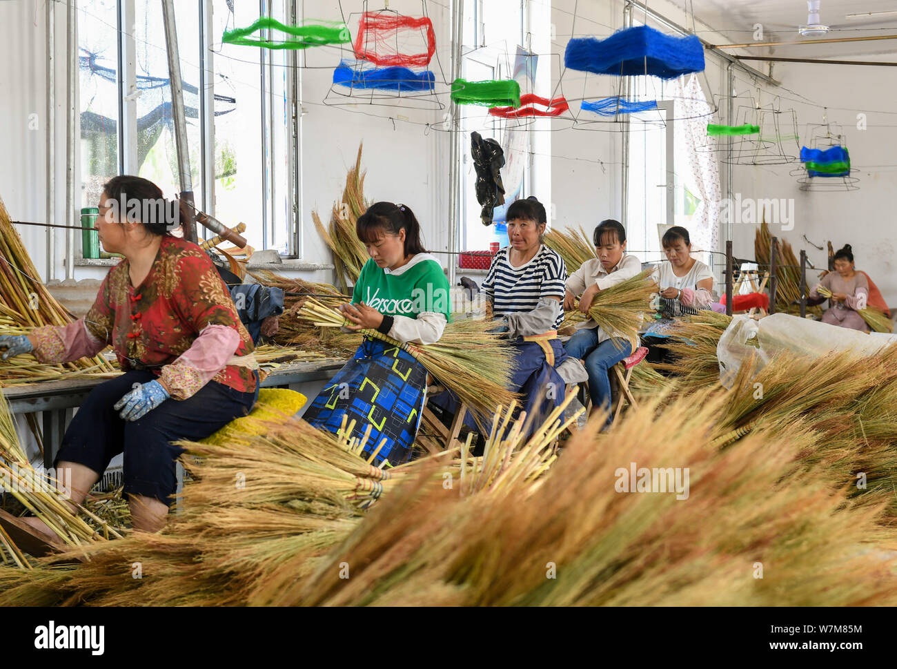 https://c8.alamy.com/comp/W7M85M/190807-chifeng-aug-7-2019-xinhua-farmers-make-brooms-at-a-poverty-alleviation-workshop-in-lindong-township-of-balin-left-banner-in-chifeng-city-north-chinas-inner-mongolia-autonomous-region-aug-5-2019-balin-left-banner-has-in-recent-years-been-committed-to-developing-the-comprehensive-industrial-chain-of-broom-that-involves-planting-processing-product-development-promotion-and-sales-and-brand-building-as-a-way-to-help-farmers-boost-their-income-by-the-end-of-2018-about-65000-people-had-been-involved-in-the-broom-industry-by-which-more-than-6000-people-had-been-lifte-W7M85M.jpg