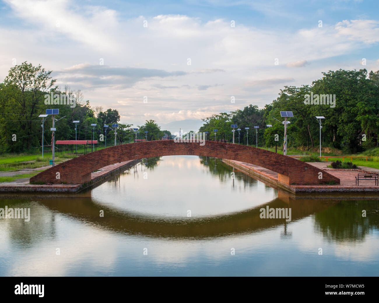 A brick bridge over some water Stock Photo