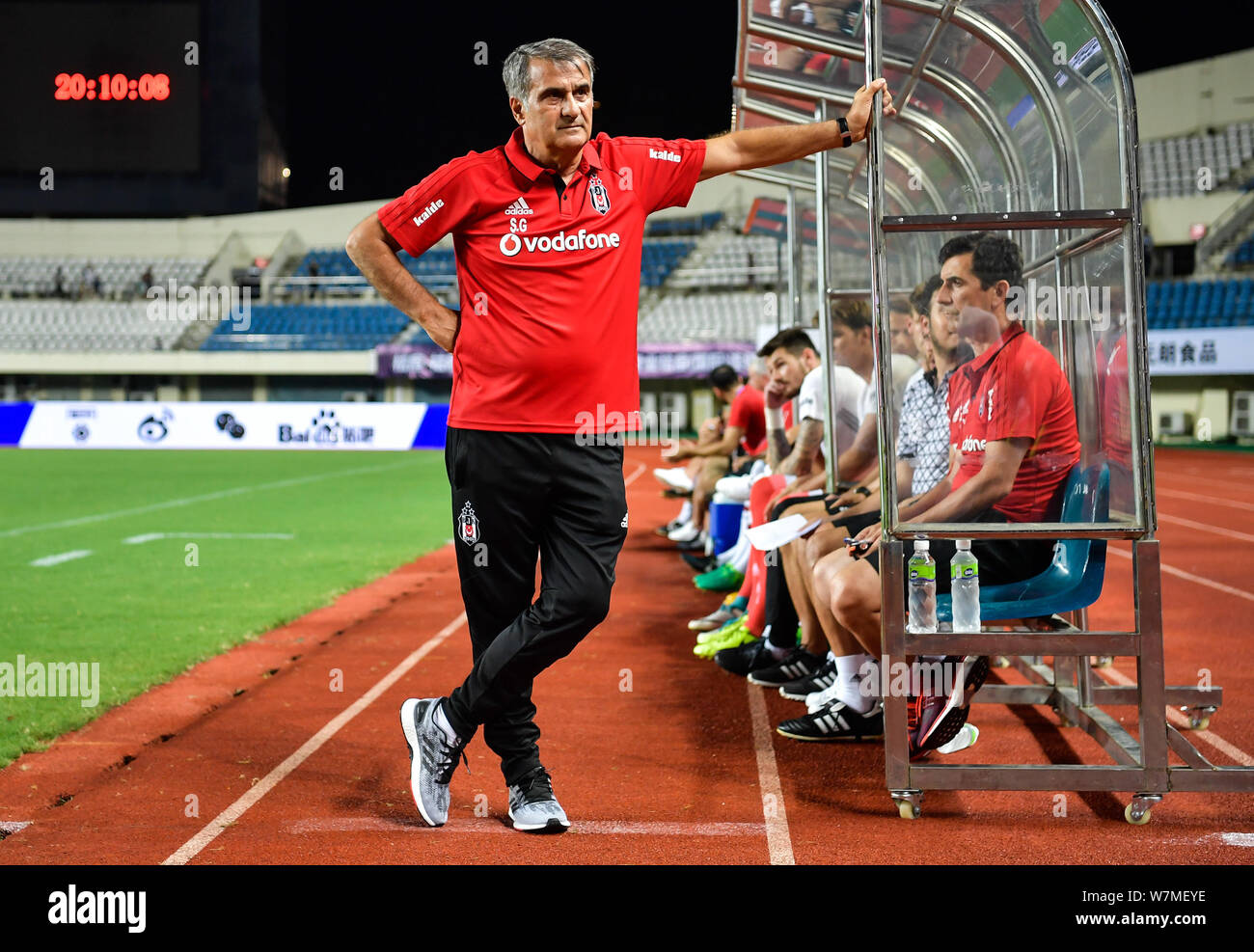 Head coach Senol Gunes of Besiktas J.K. watches his players competing  against FC Schalke 04 in a friendly soccer match in Zhuhai city, south  China's G Stock Photo - Alamy