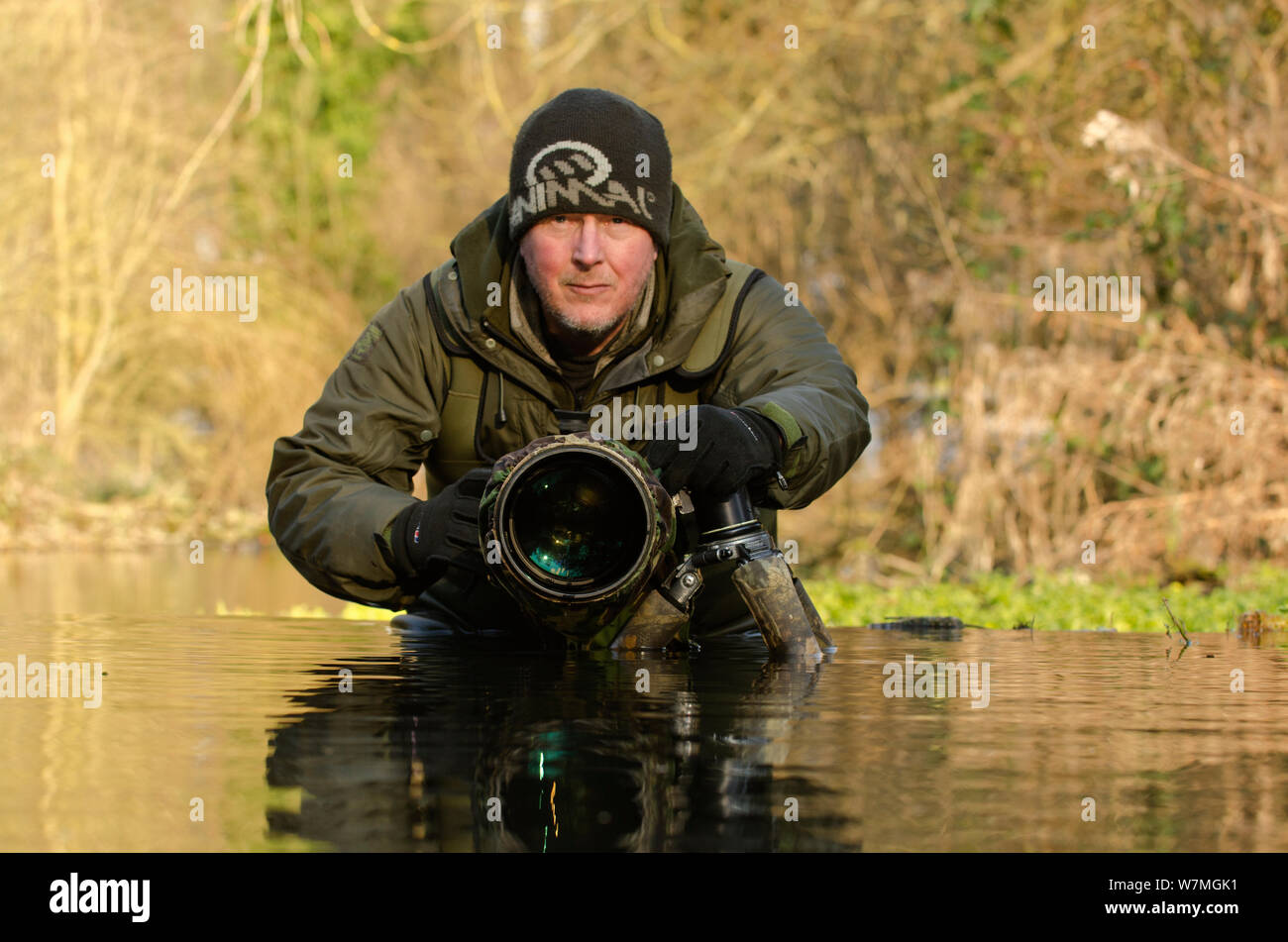 Photographer Terry Whittaker photographing Water voles (Arvicola terrestris) whilst on assignment for 2020VISION, Kent, England, UK, February 2012. 2020VISION Exhibition. Stock Photo