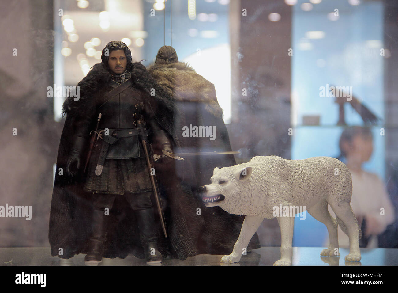 View of a replica of Jon Snow and his Direwolf displayed during the Touring Exhibition of ''Games of Thrones'' at Plaza 66 shopping mall in Shanghai, Stock Photo