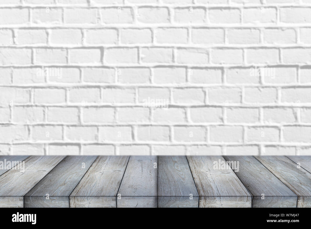 Wooden Shelf or Table in front of clean empty white brick Wall with ...