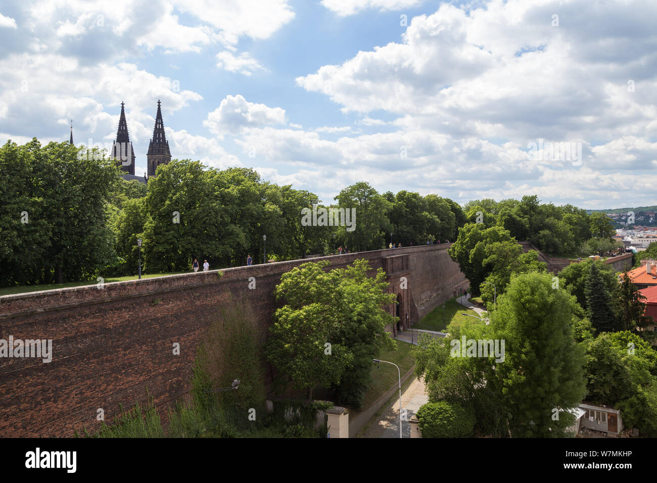 People walking at the surrounding wall on the grounds of Vysehrad Castle in Prague, Czech Republic, on a sunny day in the summer. Stock Photo