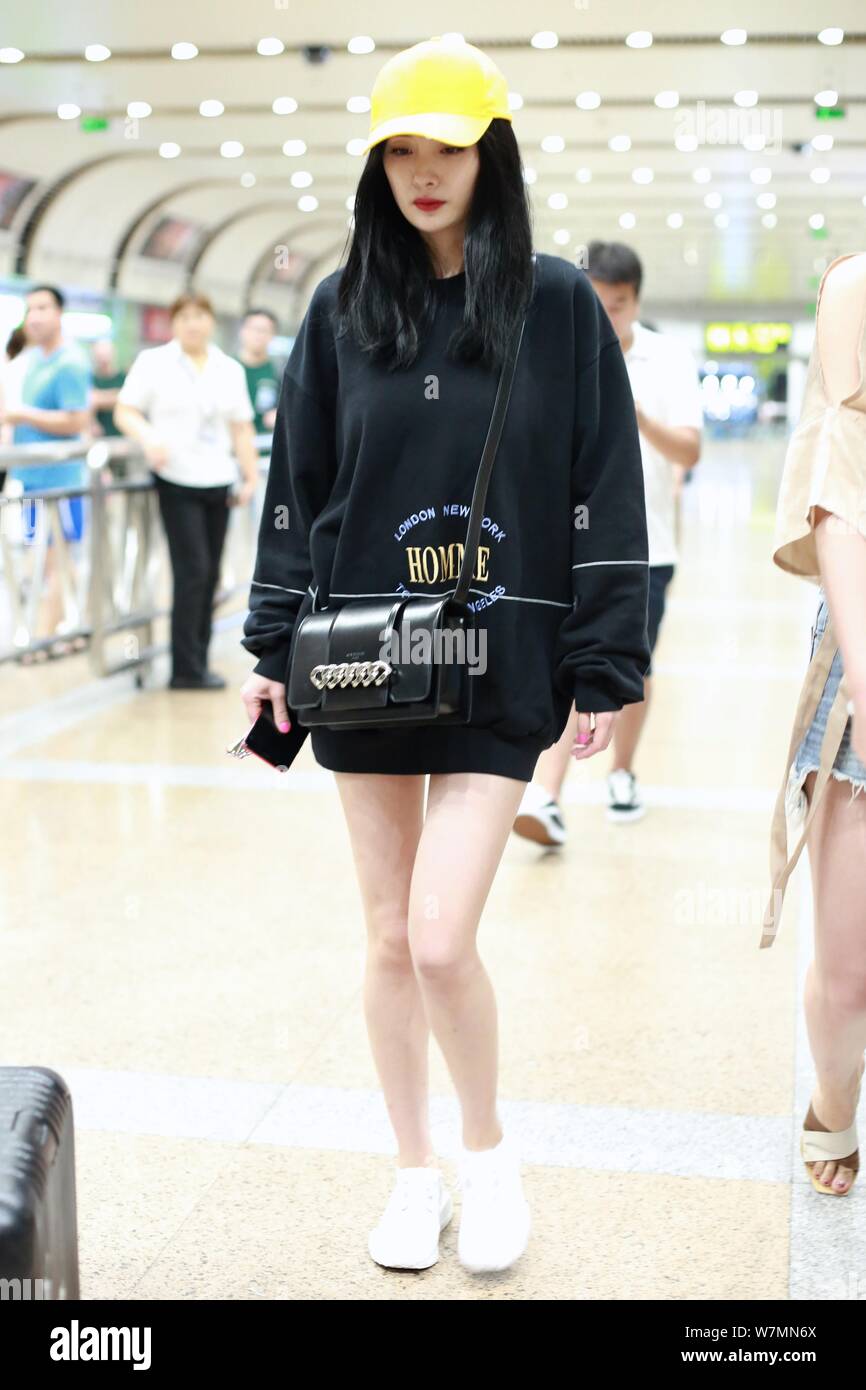 Chinese actress Yang Mi is pictured at the Beijing International Airport in  Beijing, China, 15 July 2017. Hoodie: Balenciaga Sneaker: Adidas NMD R1  Stock Photo - Alamy