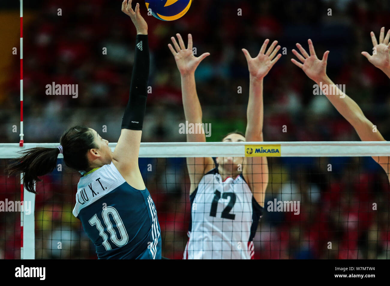 Liu Xiaotong of China, front, spikes against Kelly Murphy of the United States during the Pool B1-Group 1 match of the FIVB World Grand Prix 2017 in K Stock Photo