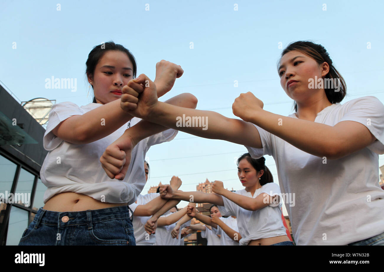 Chinese office ladies practise Chinese martial art Wing Chun to improve the health at a martial