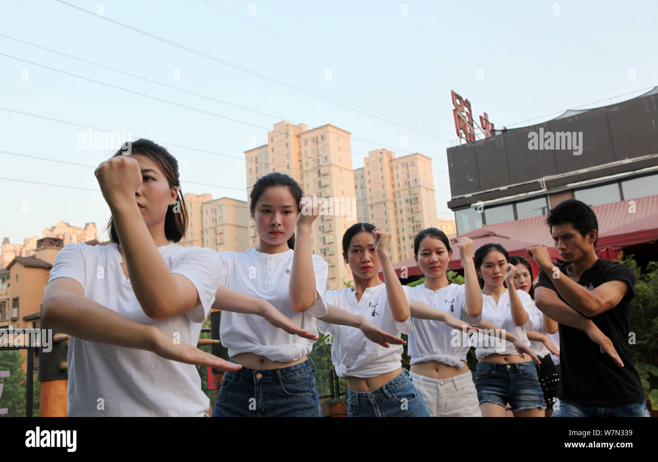 Chinese office ladies practise Chinese martial art Wing Chun to improve the health at a martial