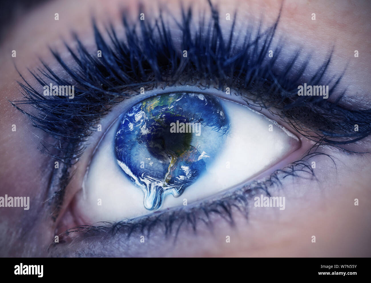 Eye with inside the World. Earth is crying due to pollution, wars, terrorism. Globe provided by NASA Stock Photo