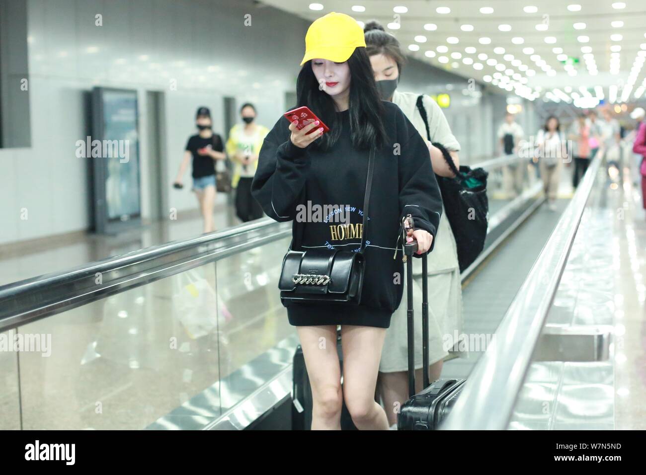 Chinese actress Yang Mi is pictured at the Beijing International Airport in  Beijing, China, 15 July 2017. Hoodie: Balenciaga Sneaker: Adidas NMD R1  Stock Photo - Alamy