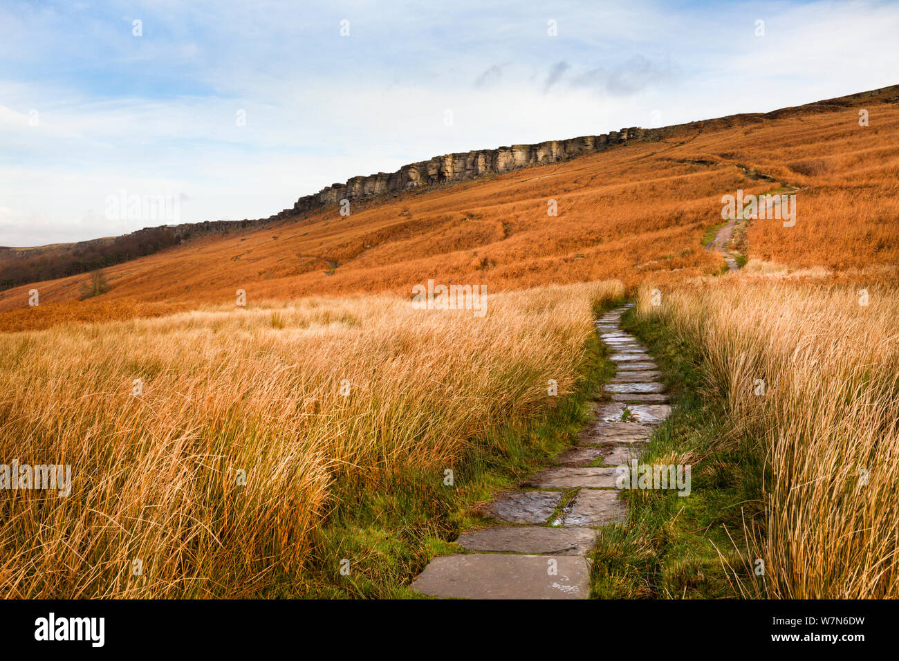 Stone flagged footpath leading to Stanage Edge, Peak District National Park, UK, December 2011. Stock Photo
