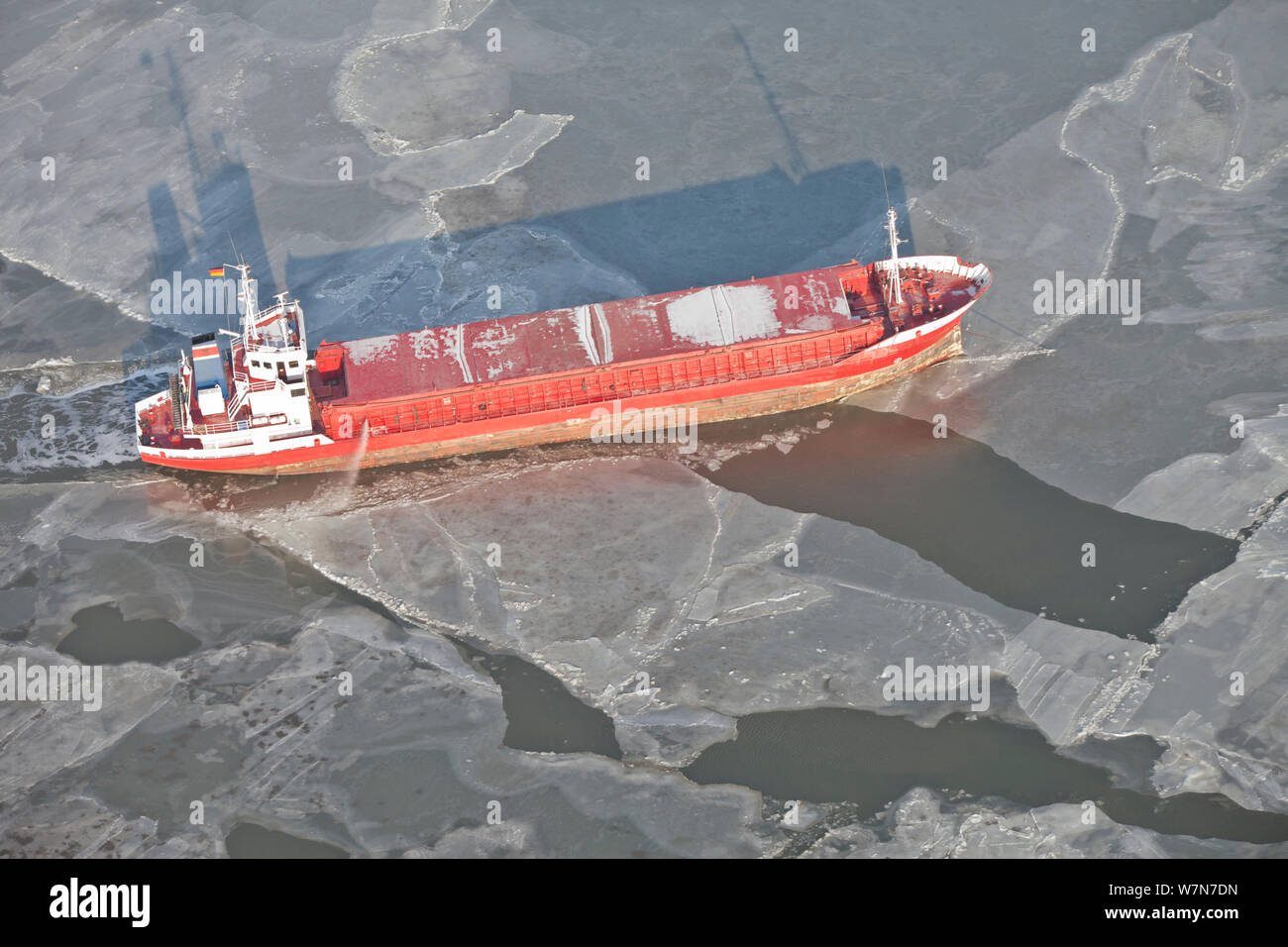 Ship breaking through sea ice. North Sea, Wadden Sea, Germany, February 2012. Stock Photo