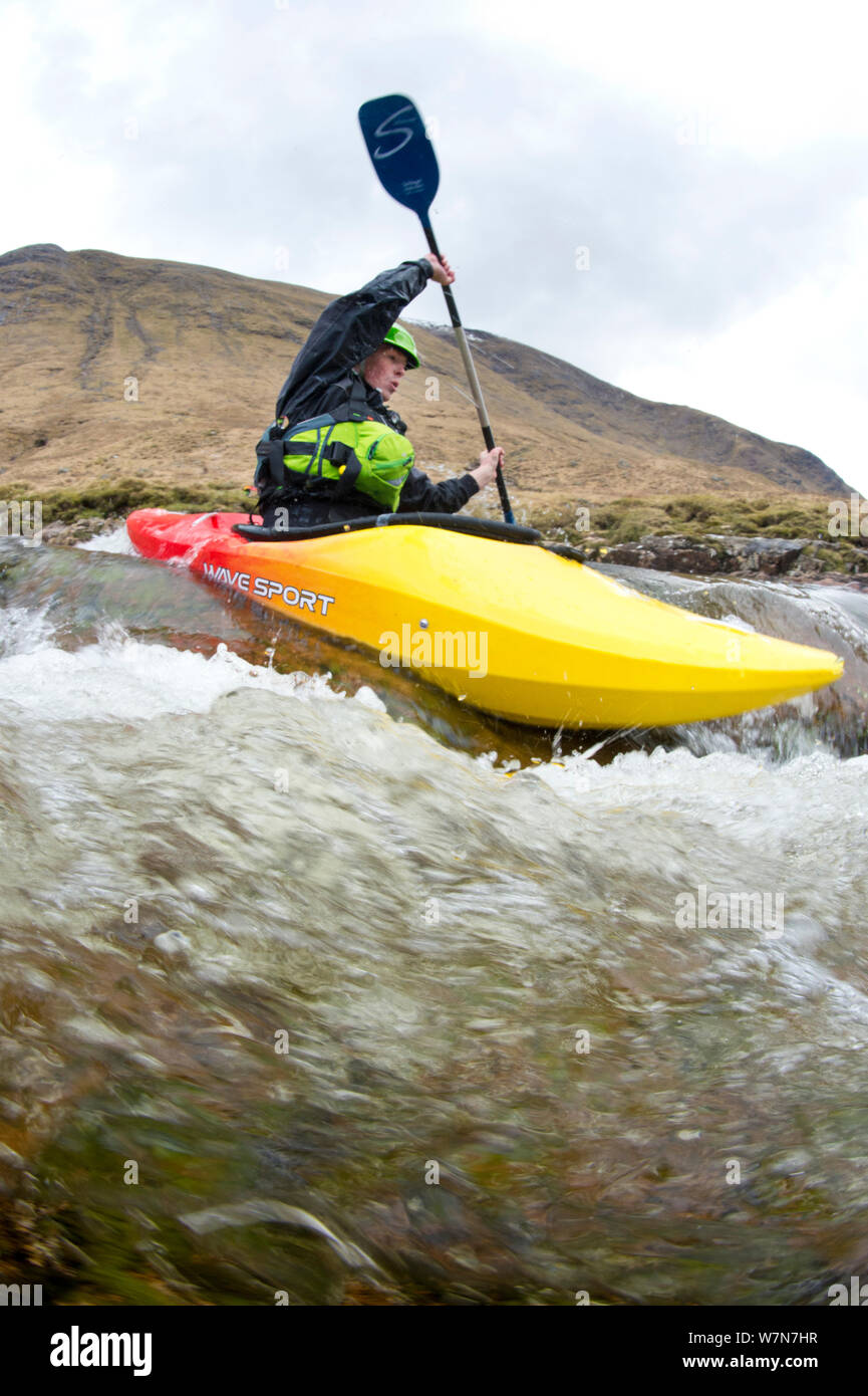 Kayaker on the River Etive, Highlands, Scotland, UK, April 2012. Stock Photo