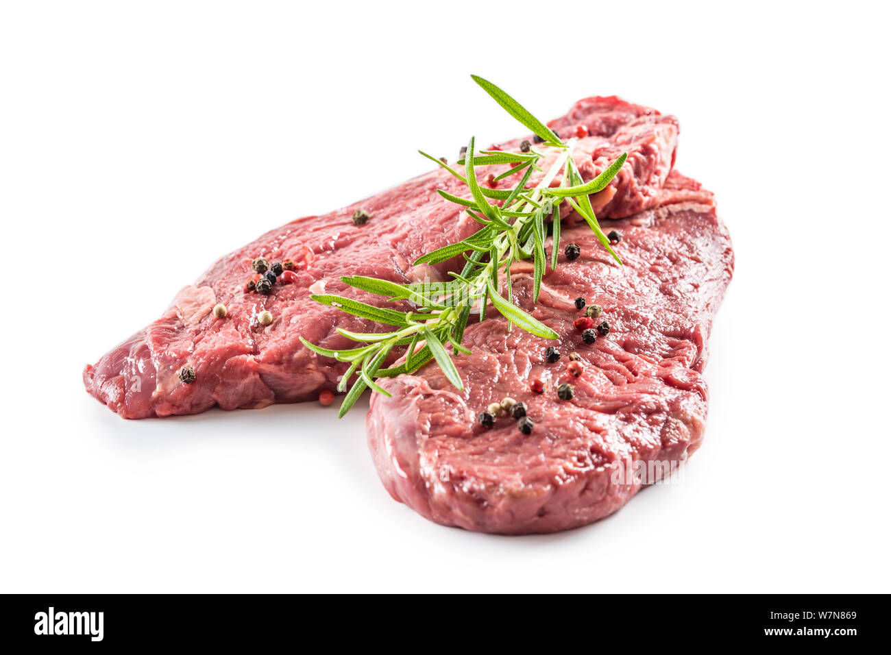 Beef meeat Rib-Eye steak wit rosemary salt and pepper isolated on white Stock Photo