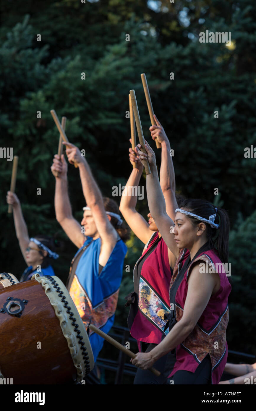 Seattle Kokon Taiko performs at the Toro Nagashi Lantern Floating Ceremony in Seattle, Washington on August 6, 2019. “From Hiroshima To Hope” is held in remembrance of atomic bomb victims on the anniversary of the bombing of Hiroshima, Japan. The ceremony, organized by a collation of peace, religious, civil liberties and cultural heritage organizations, honors victims of the bombings of Hiroshima and Nagasaki, and all victims of violence. It is an adaptation of an ancient Japanese Buddhist ritual, the Toro Nagashi, in which lanterns representing the souls of the dead are floated out to sea and Stock Photo