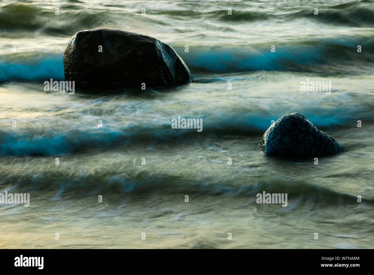 Waves of the Baltic sea wahing round rocks on shore, September Stock Photo