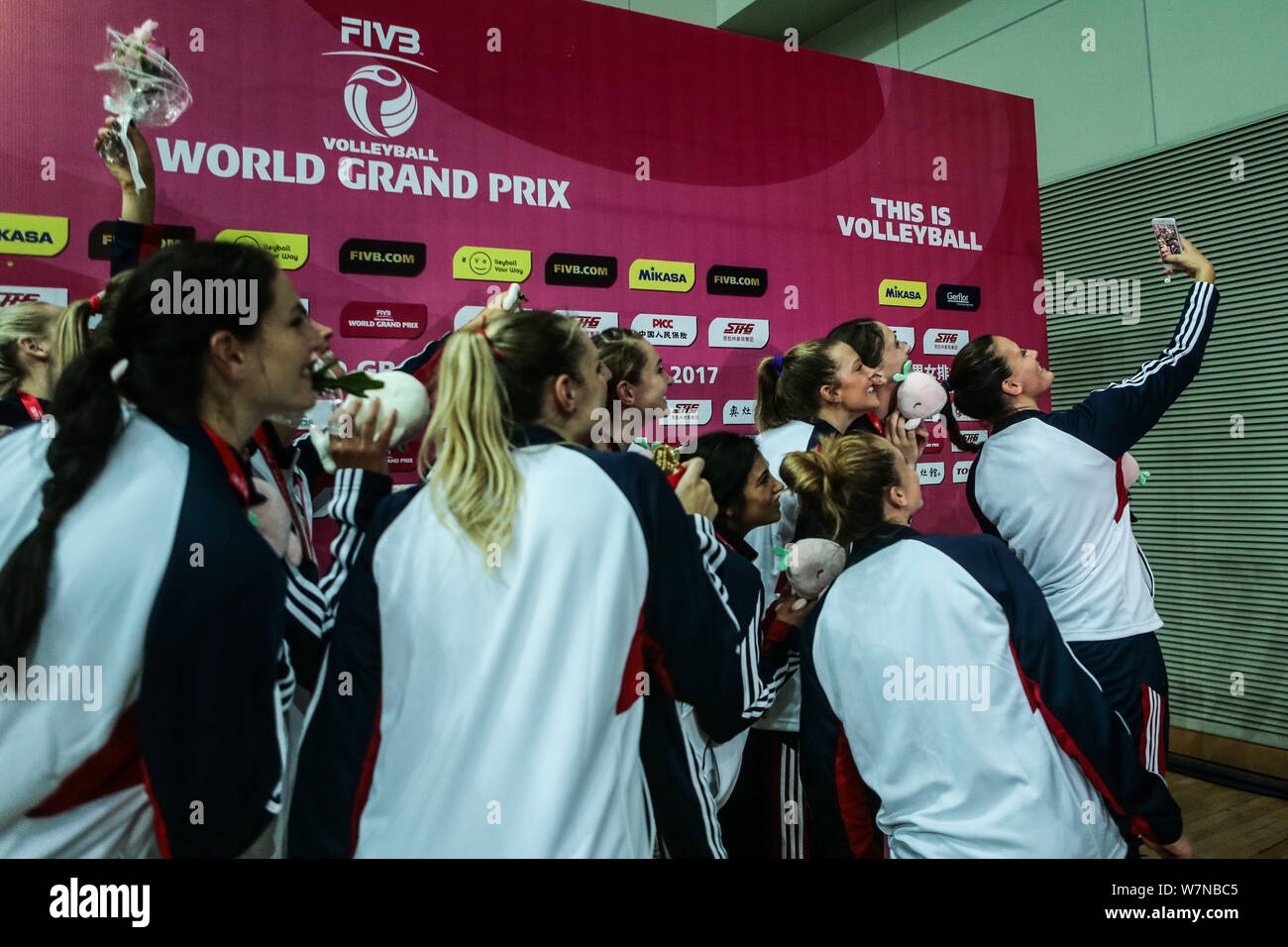 Winner United States' players pose for selfies at the award ceremony after the Pool B1-Group 1 match of the FIVB Volleyball World Grand Prix 2017 in K Stock Photo