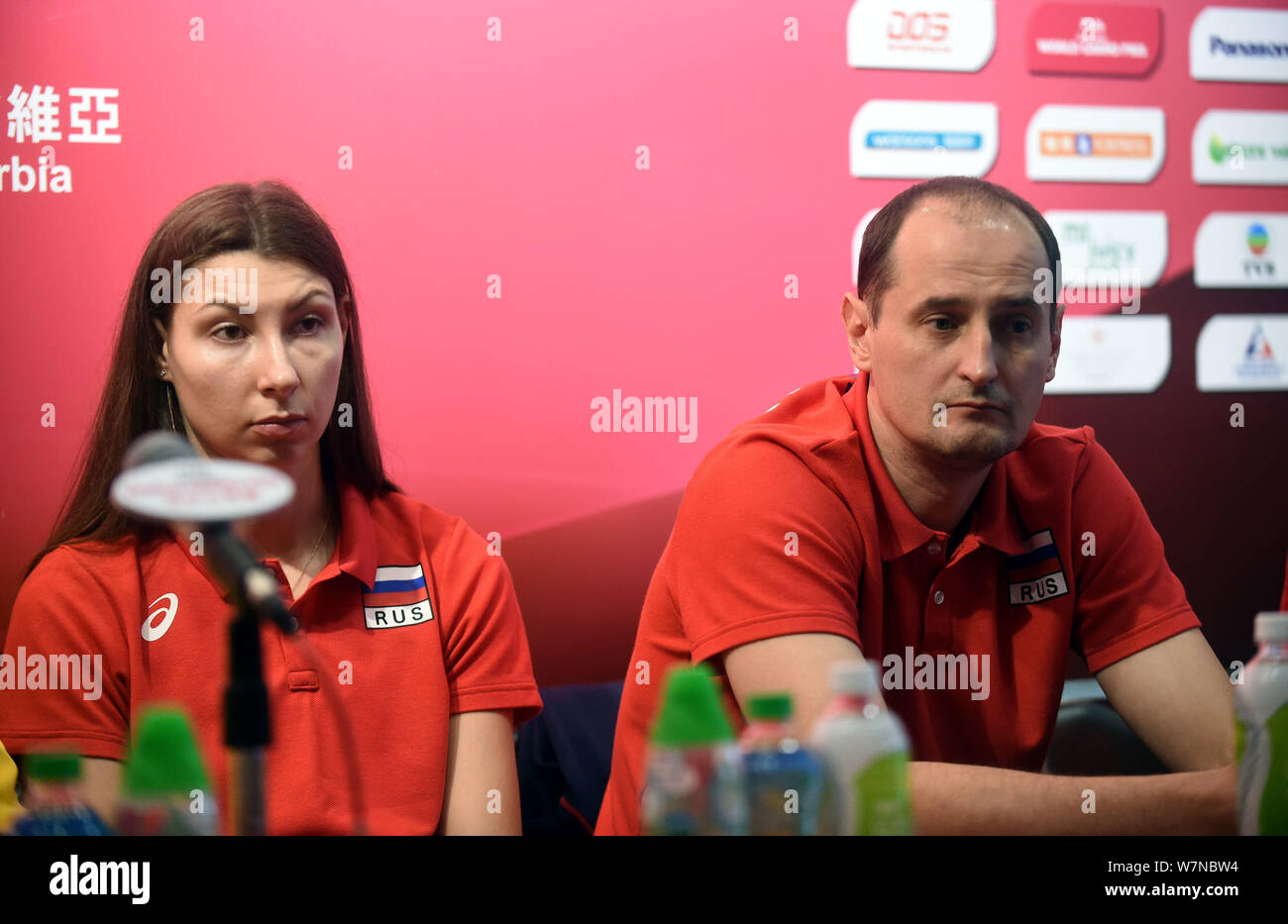 Irina Zaryazhko, left, and coach Kuziutkin Vladimir of Russia attend a press conference for the Pool G1-Group 1 match during the FIVB Volleyball World Stock Photo
