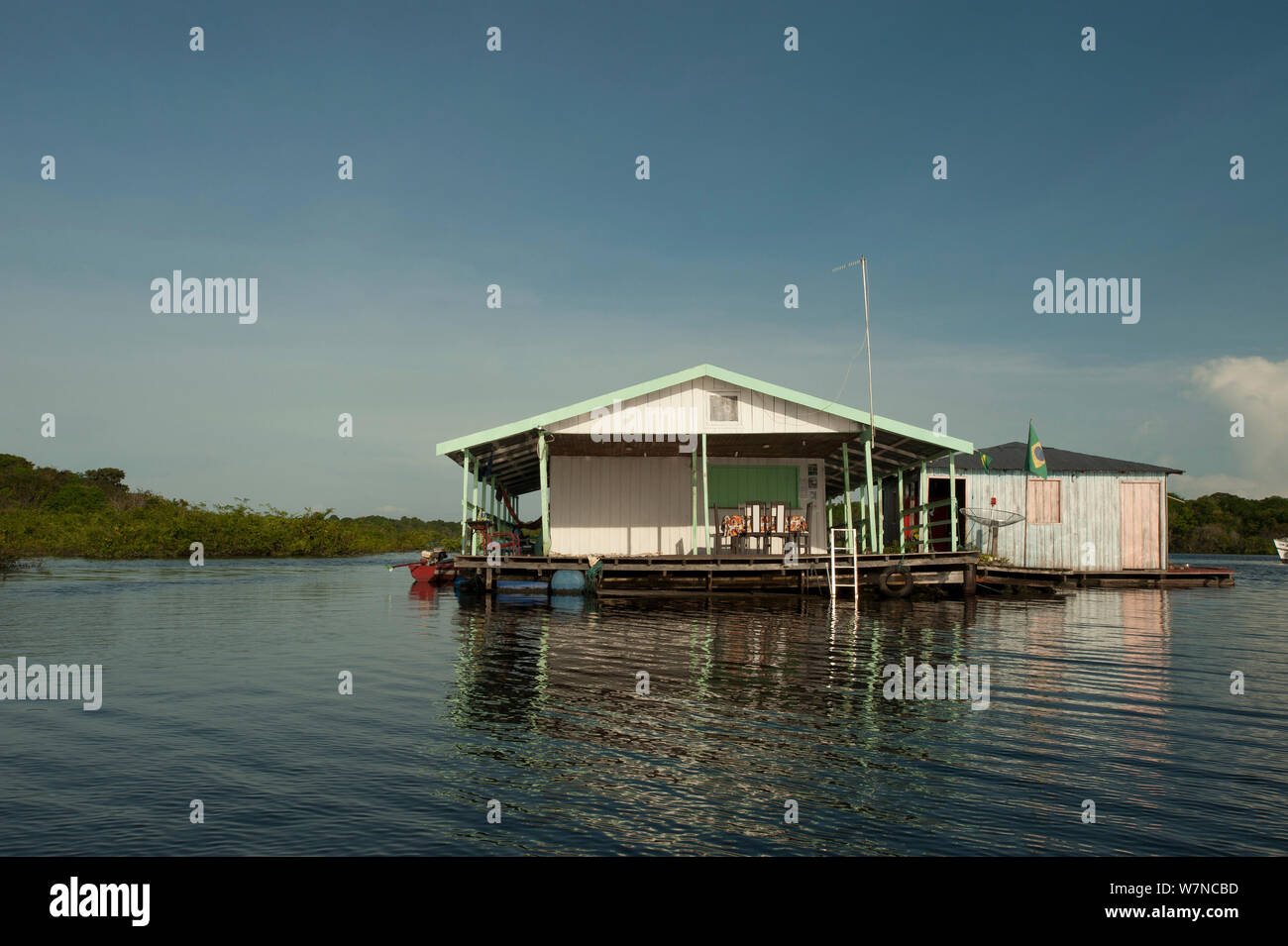 Floating house doubling as a small store for the locals selling produce