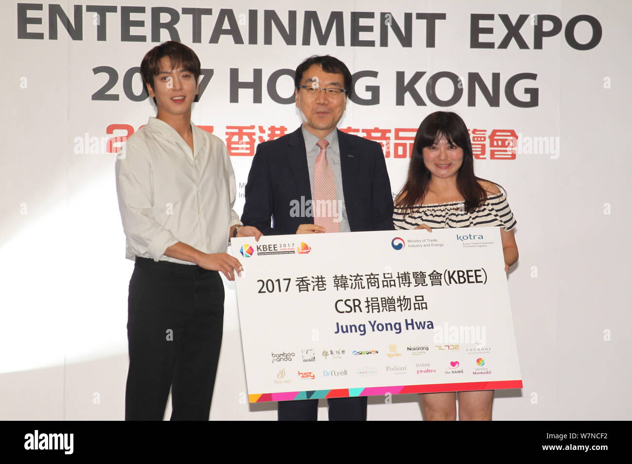 South Korean actor and singer Jung Yong-hwa, left, attends an autograph