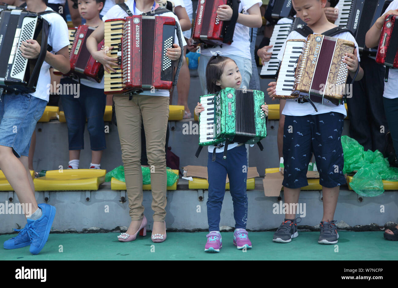 Participants play the accordion during an attempt to set a new Guinness