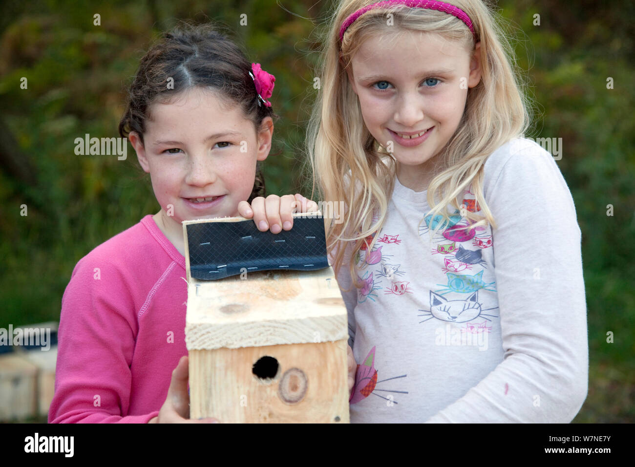 Two girls holding birdboxes, part of Flora of the Fells day. Helvellyn, Lake District National Park, Cumbria, England, UK, September. 2020VISION Book Plate. Stock Photo