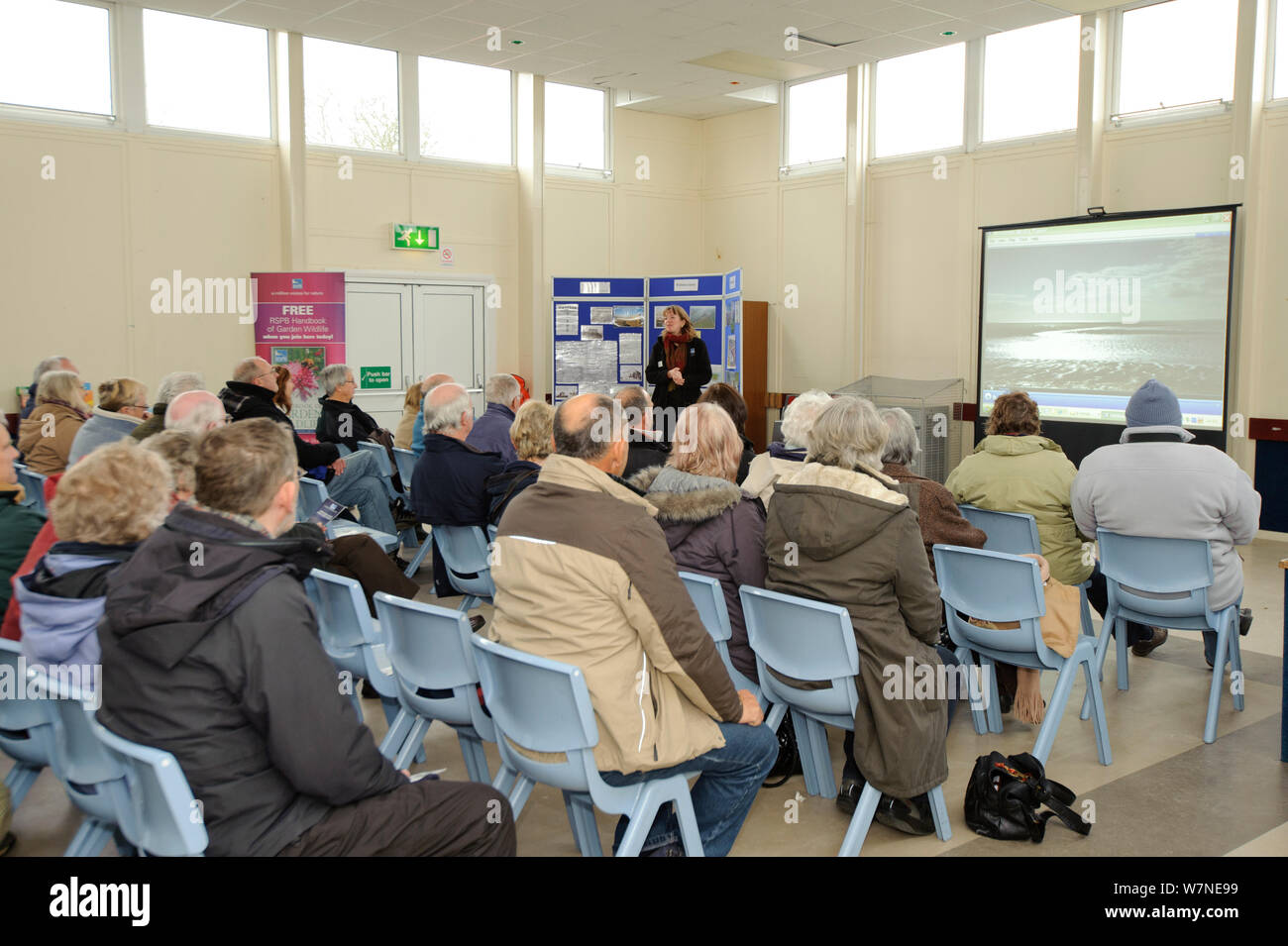 An event to introduce the local community to the RSPB Wallasea Wild Coast Project. Project manager, Chris Tyas, shows visitors a film, explaining the project and the plans for the future of Wallasea Island, Essex, UK, January 2011, Model released. 2020VISION Book Plate. Stock Photo
