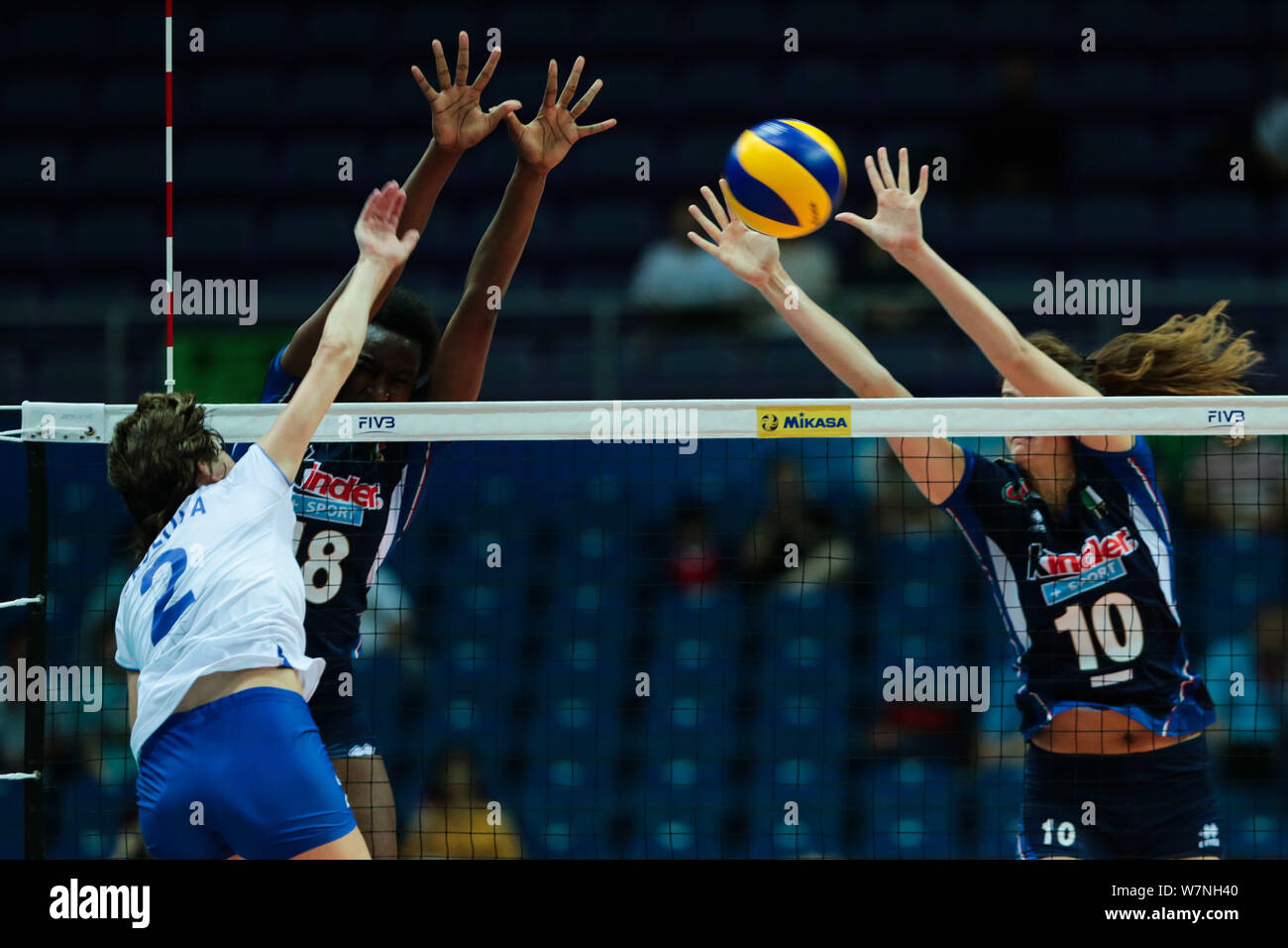 Mariia Frolova, front, of Russia spikes against Paola Ogechi Egonu, and