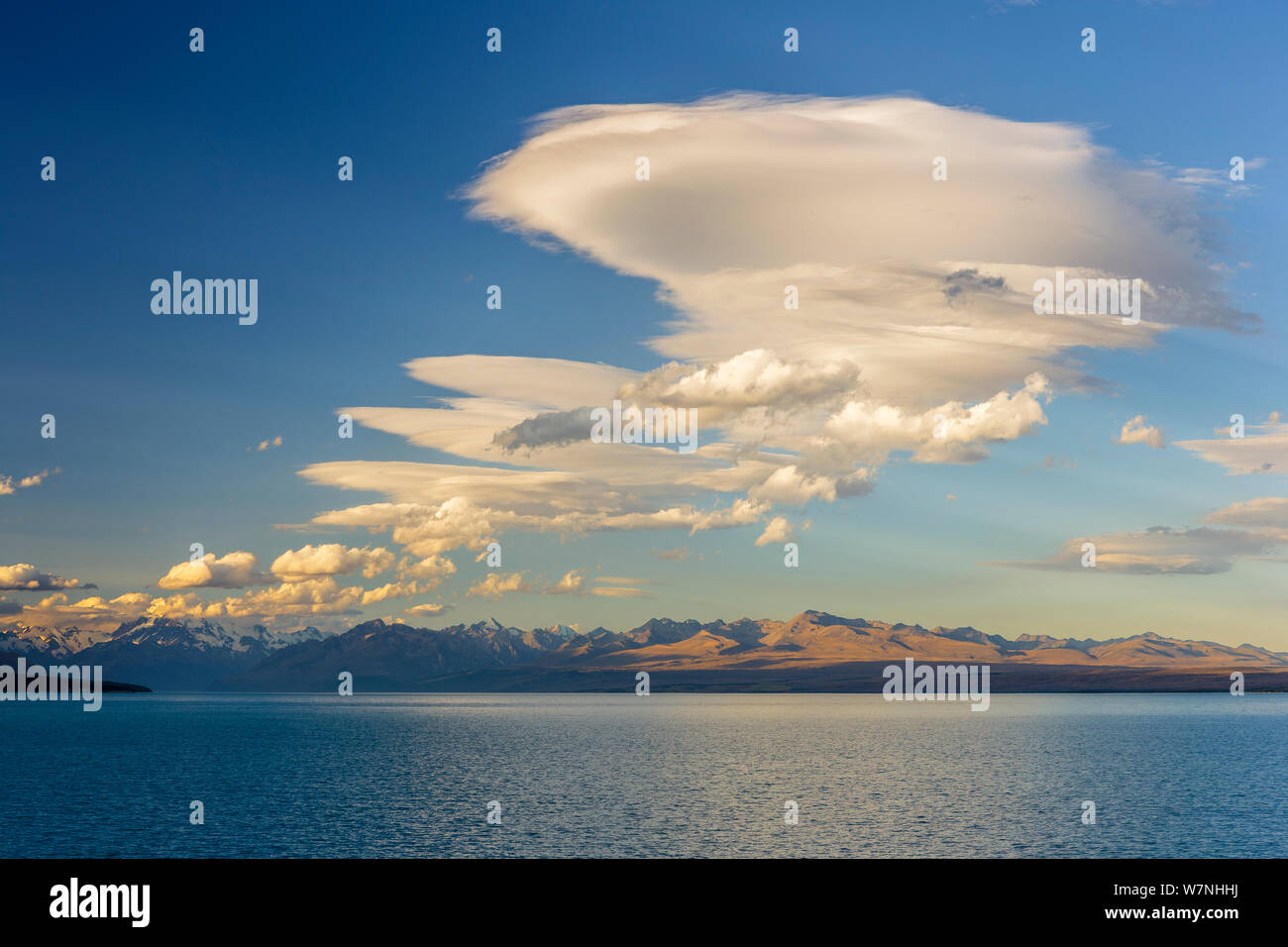 Lenticular clouds over Lake Pukaki and the Southern Alps. Aoraki/Mount Cook National Park, Mackenzie District, Canterbury, South Island, New Zealand. January, 2009. Stock Photo