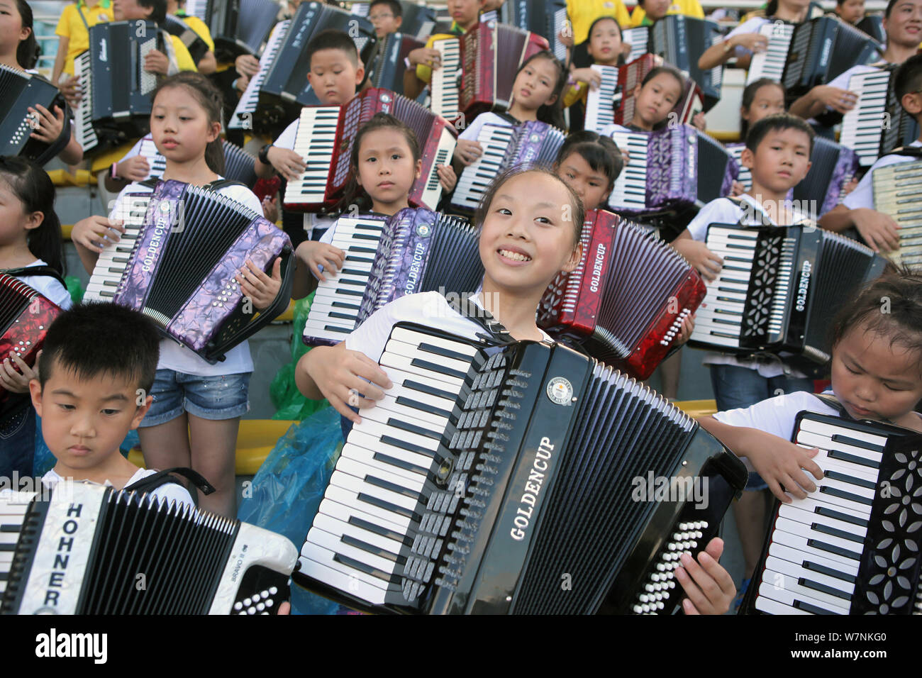 Participants play the accordion during an attempt to set a new Guinness
