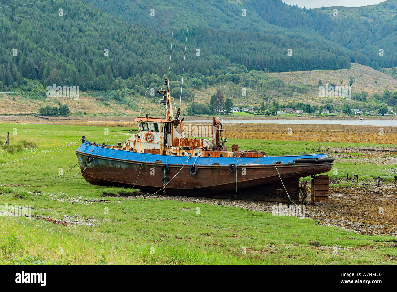 Tugboat on the shores of Loch Duich, Scotland - views Stock Photo