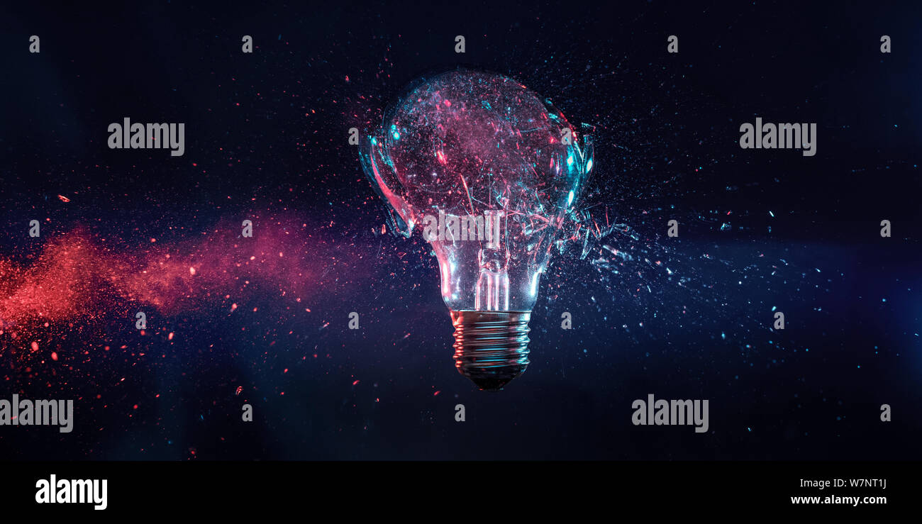 explosion of a filament electric bulb at the moment of impact. high