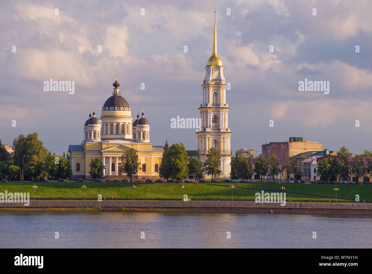 View of the Transfiguration Cathedral on the banks of the Volga river on  warm July evening. Rybinsk, Russia Stock Photo