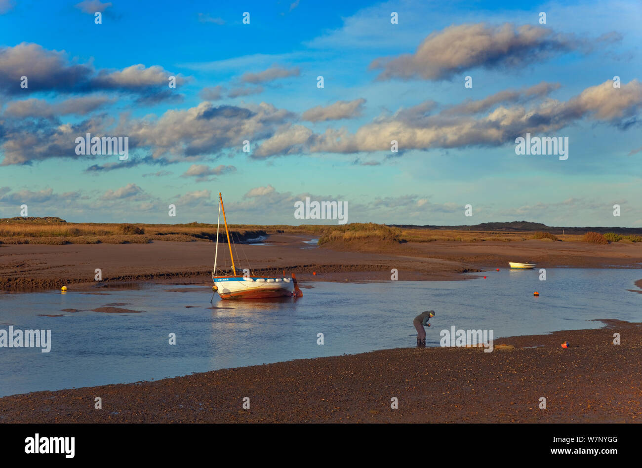 Boat on beach at low tide, Burnham Overy Staith, Norfolk, November 2012 Stock Photo