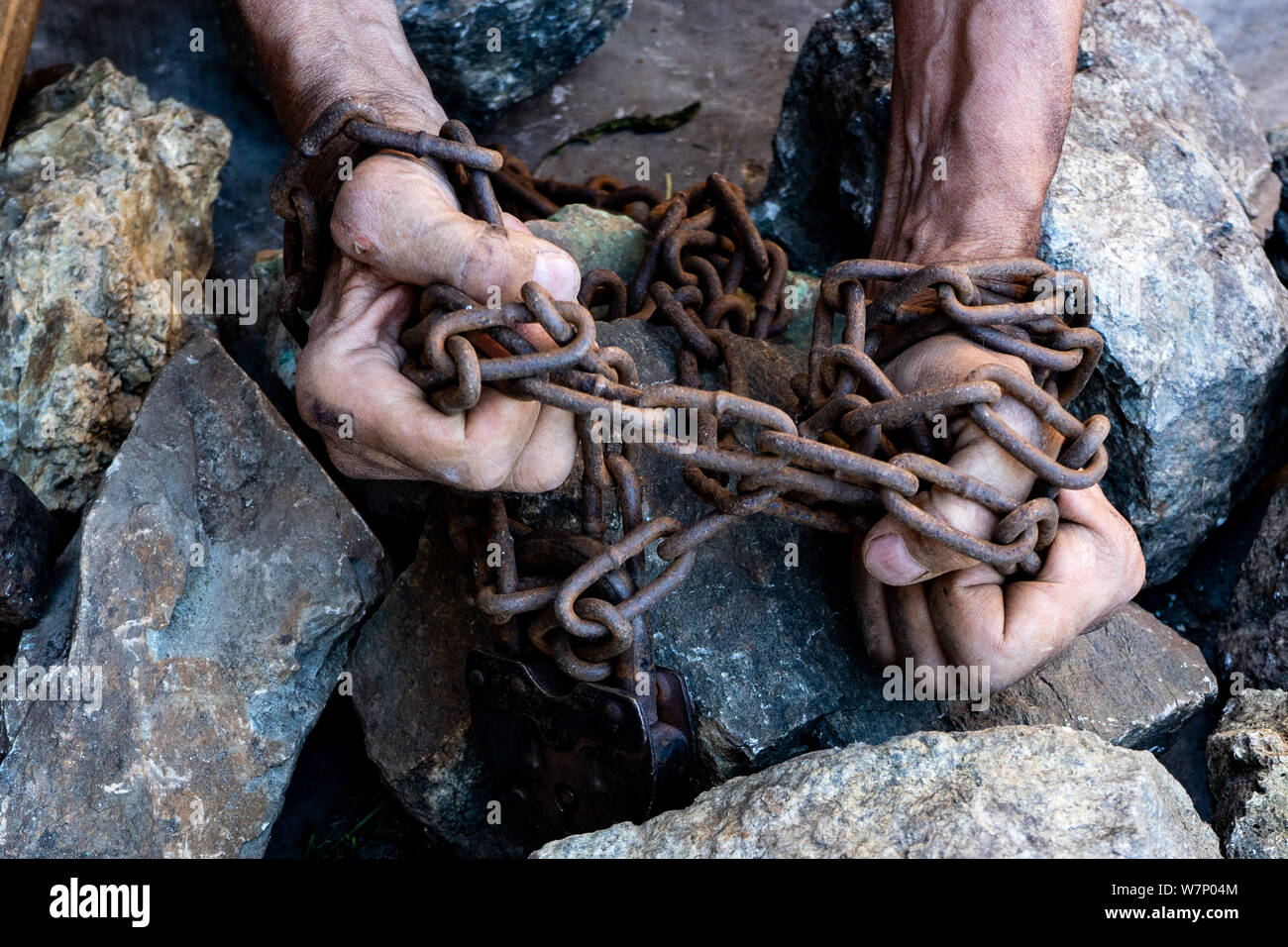 The hands of a slave in an attempt to release. The symbol of slave