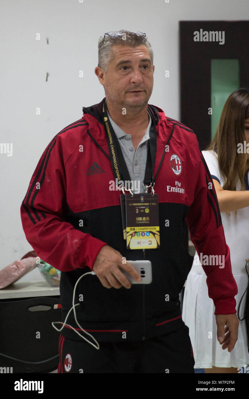 Italian former footballer Daniele Massaro watches AC Milan competing