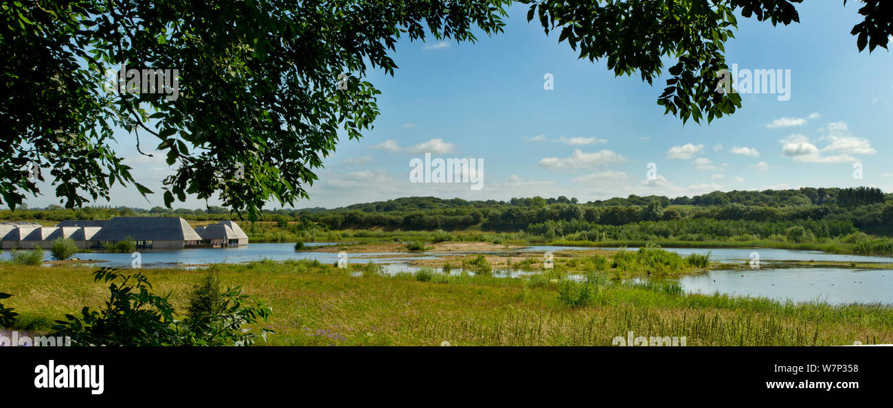 Landscape View Over Wetland Pool With Visitor Centre In Background 